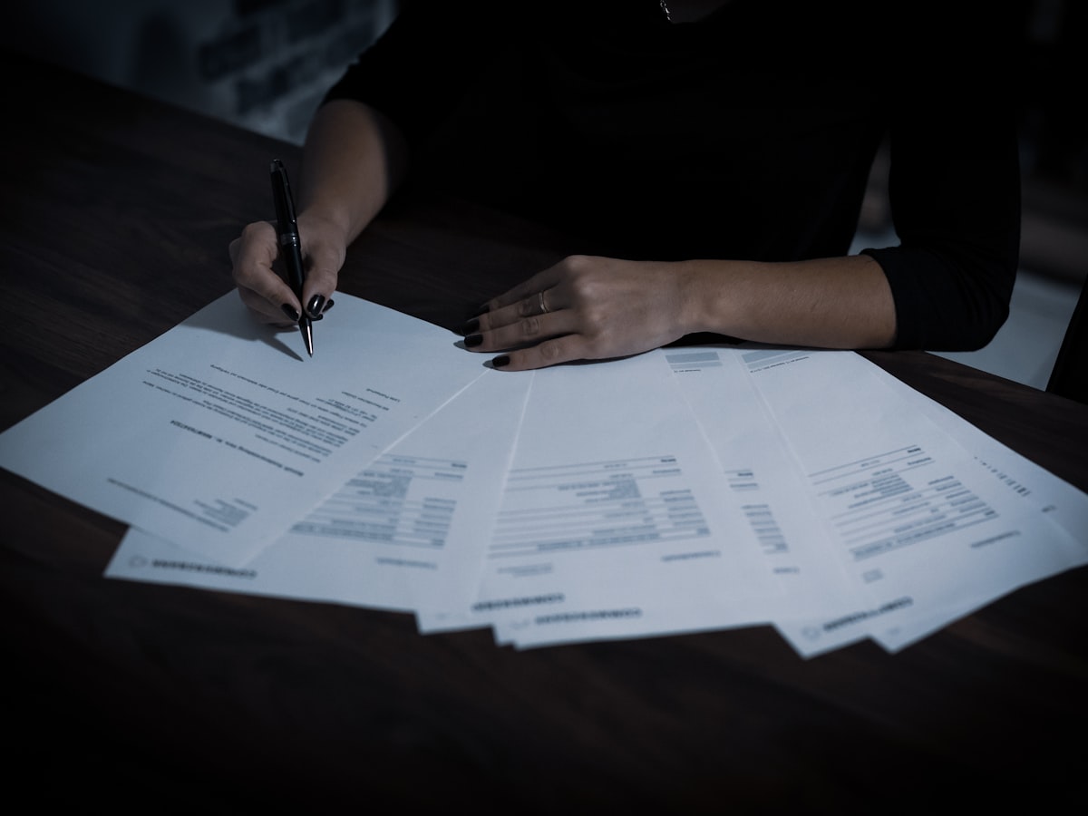 Specialist reviewing a spread of financial documents
